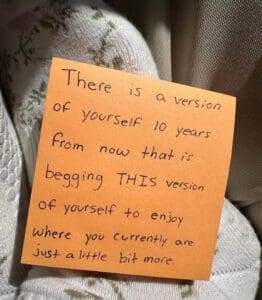 orange post it note with quote