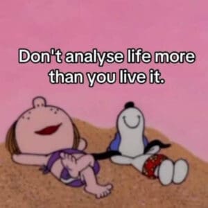 snoopy and friend laying in sand